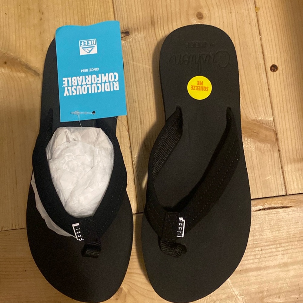 Size 7 Reef Black cushion breeze flip flops